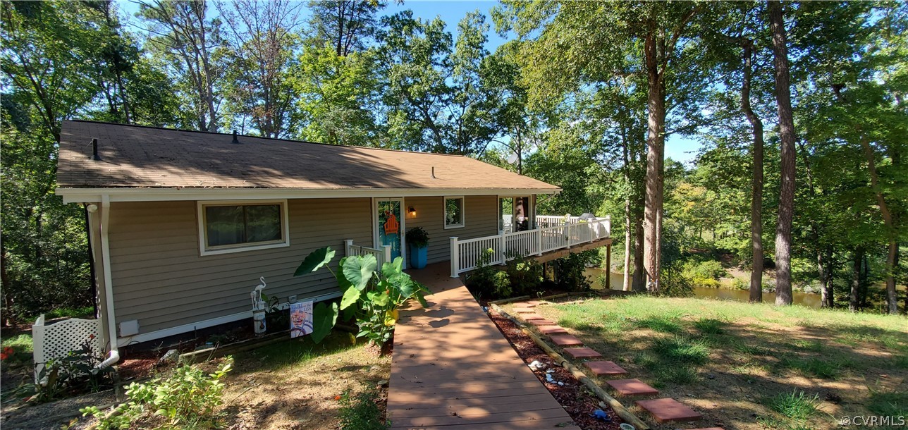 347 Hickory Road Lancaster, VA 22503 - Photo 1 of 48 a view of house with a yard and potted plants