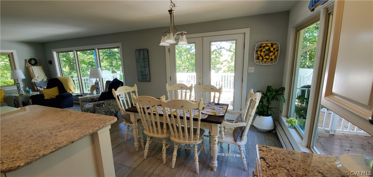 347 Hickory Road Lancaster, VA 22503 - Photo 12 of 48 a view of a dining room with furniture window and wooden floor