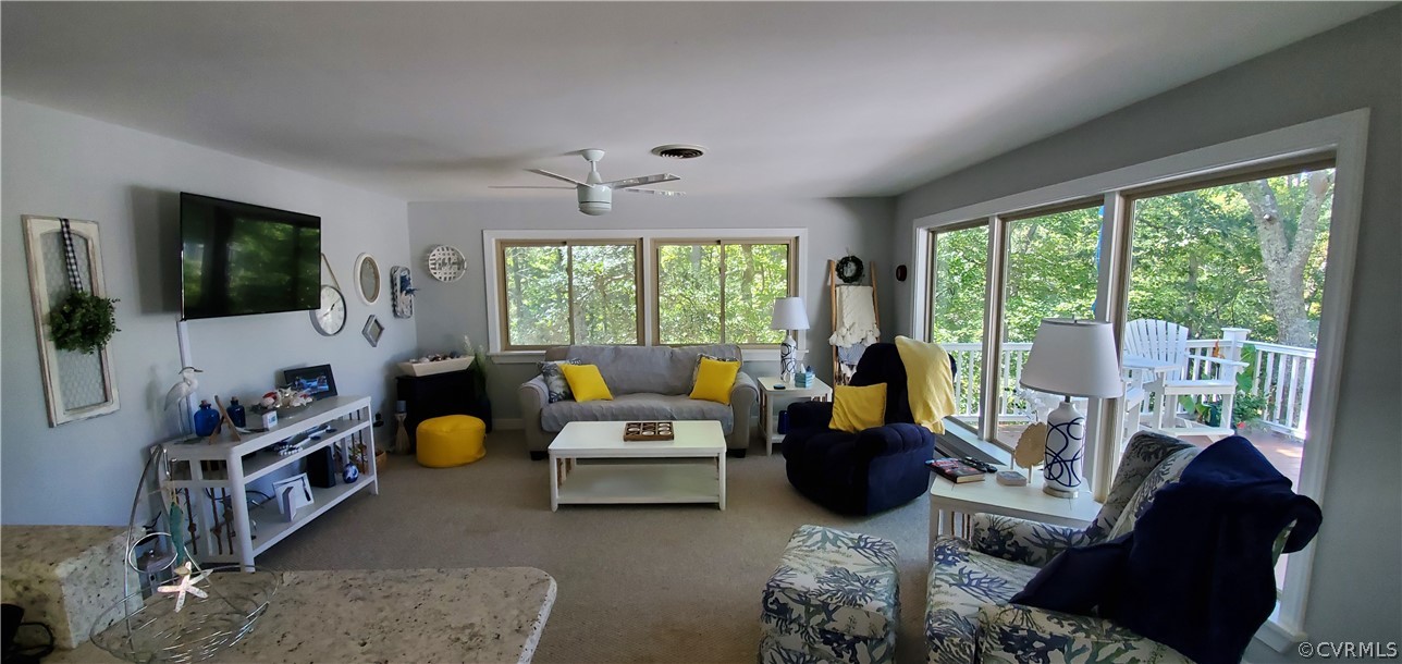347 Hickory Road Lancaster, VA 22503 - Photo 13 of 48 a living room with furniture and a flat screen tv