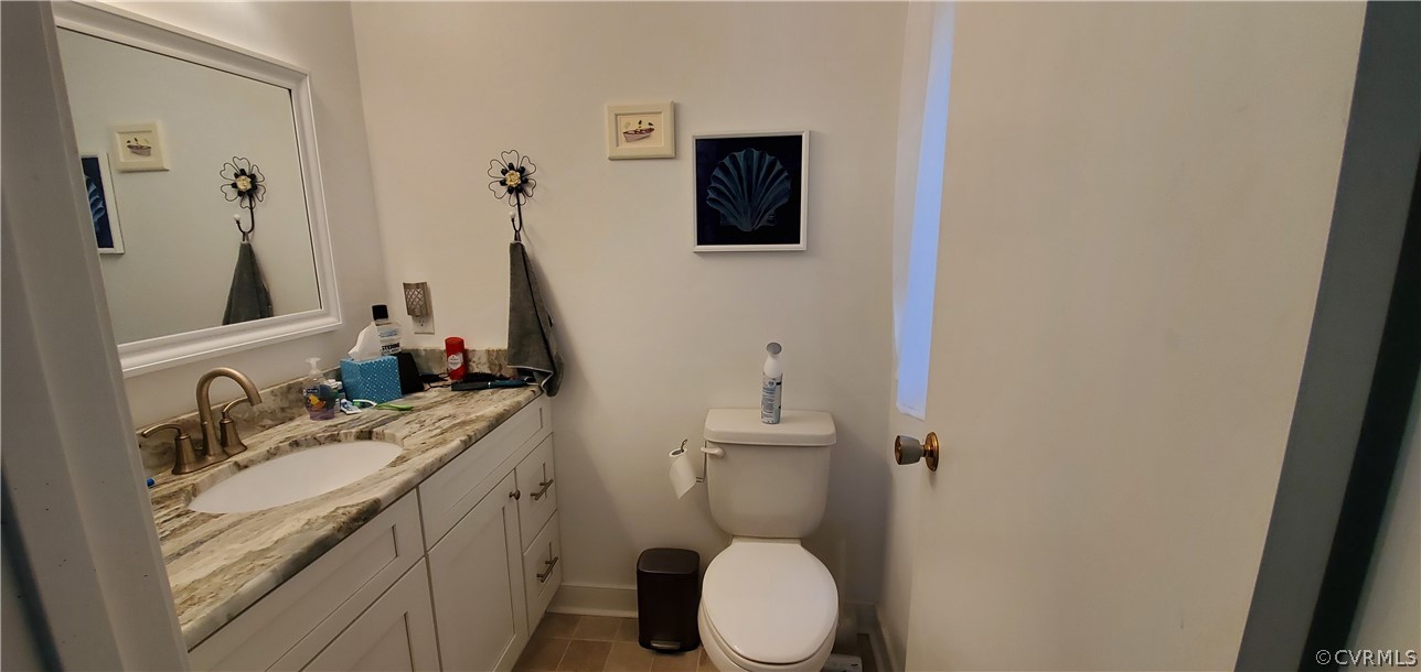 347 Hickory Road Lancaster, VA 22503 - Photo 19 of 48 a bathroom with a sink a toilet and a mirror