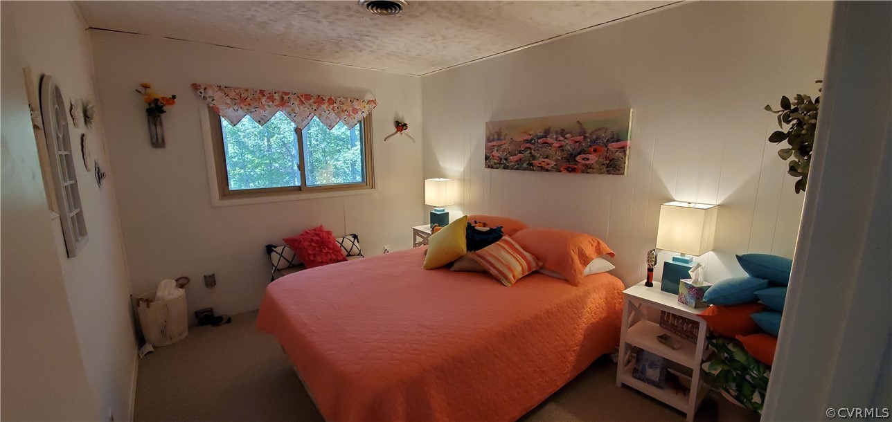 347 Hickory Road Lancaster, VA 22503 - Photo 20 of 48 a bedroom with a bed and a window