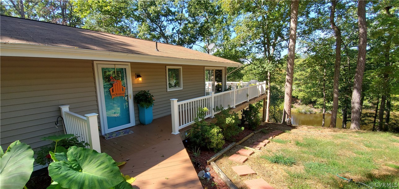 347 Hickory Road Lancaster, VA 22503 - Photo 2 of 48 a view of a house with backyard and sitting area