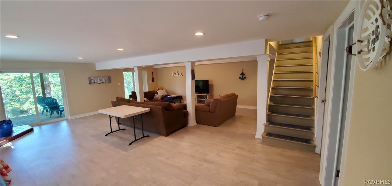 347 Hickory Road Lancaster, VA 22503 - Photo 24 of 48 a view of a livingroom with furniture and staircase