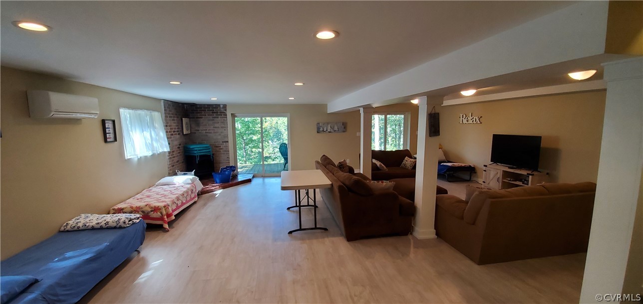 347 Hickory Road Lancaster, VA 22503 - Photo 25 of 48 a living room with furniture and a flat screen tv