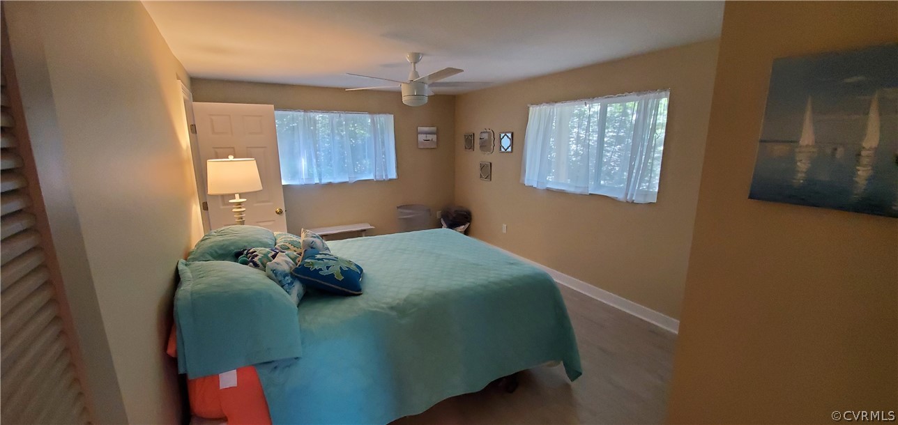 347 Hickory Road Lancaster, VA 22503 - Photo 27 of 48 a bedroom with a bed and window