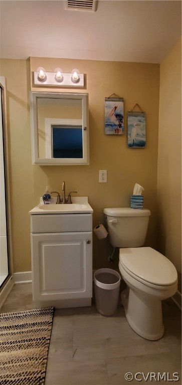 347 Hickory Road Lancaster, VA 22503 - Photo 28 of 48 a bathroom with a toilet sink and mirror