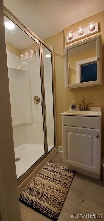 347 Hickory Road Lancaster, VA 22503 - Photo 29 of 48 a bathroom with a sink a mirror and a shower