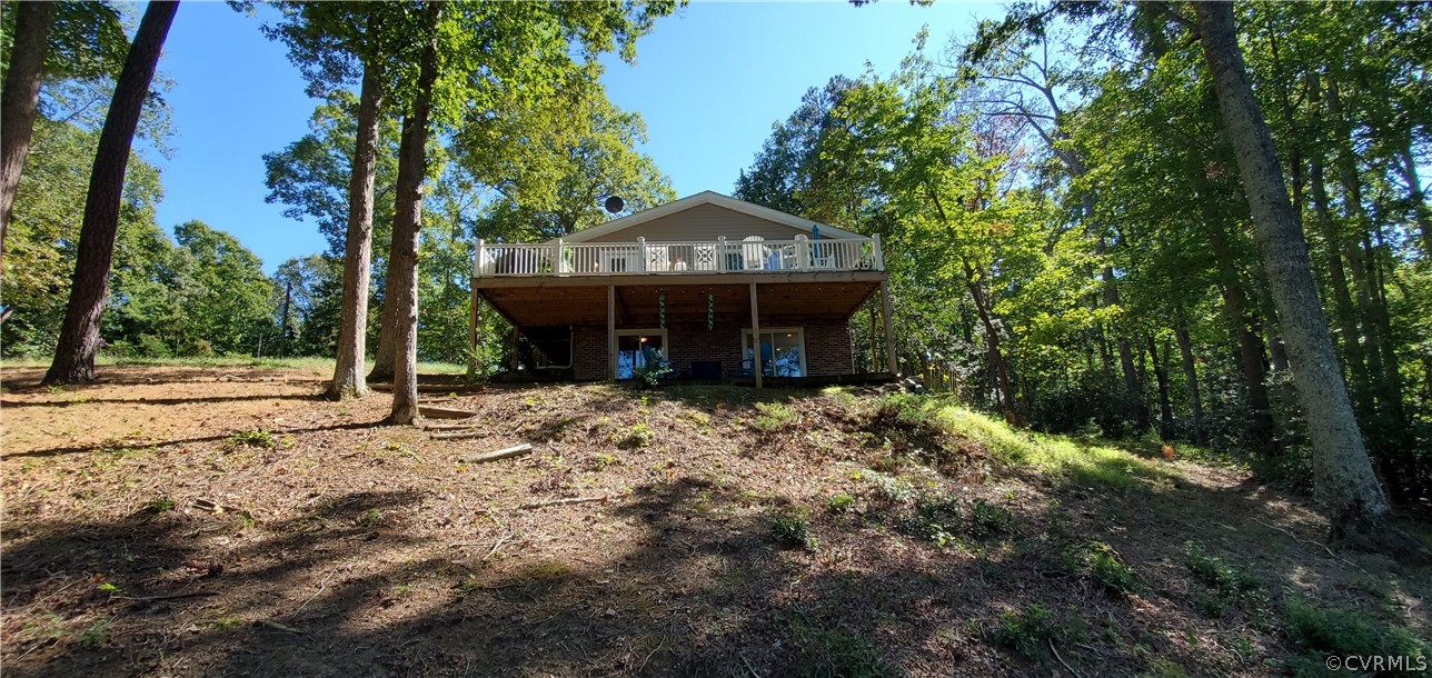 347 Hickory Road Lancaster, VA 22503 - Photo 35 of 48 a view of a house with a small yard and large tree