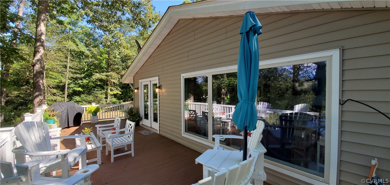 347 Hickory Road Lancaster, VA 22503 - Photo 4 of 48 a backyard of a house with table and chairs