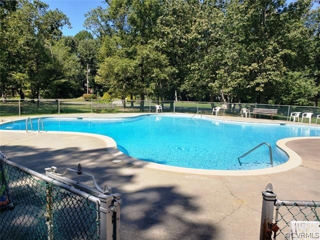 347 Hickory Road Lancaster, VA 22503 - Photo 46 of 48 a view of a swimming pool with a yard