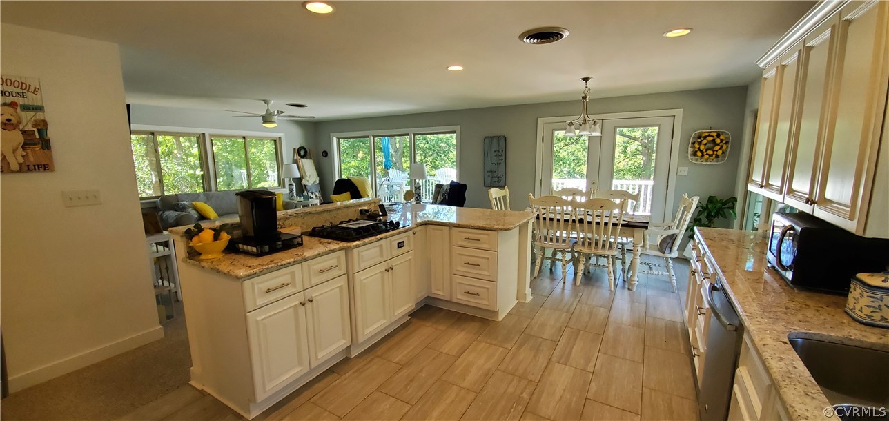 347 Hickory Road Lancaster, VA 22503 - Photo 10 of 48 a view of a dining room with furniture window and wooden floor
