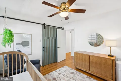 a bedroom with furniture and a window