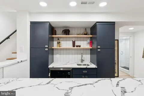 a bedroom with a bed and cabinets