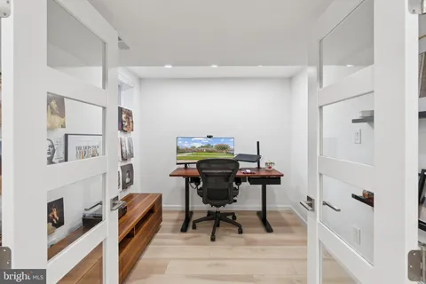 a workspace with furniture and wooden floor
