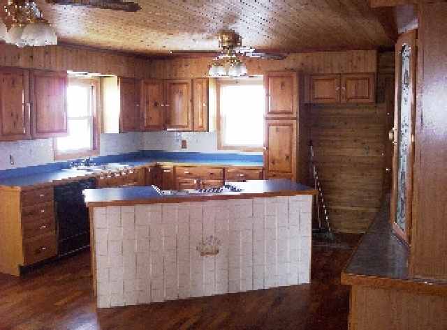 5264 East Johnson Road Freeport, IL 61032 - Photo 4 of 4 a kitchen with a wooden floor and a sink
