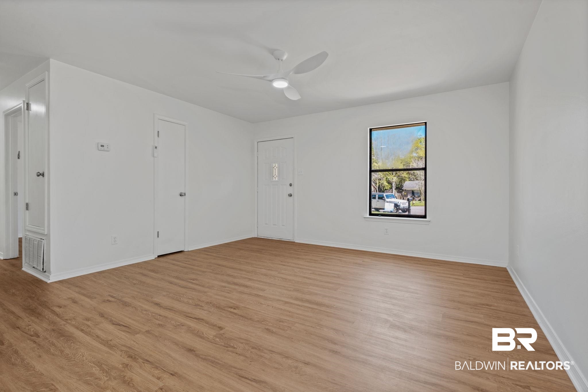 5734 Pheasant Court Theodore, AL 36582 - Photo 3 of 23 Spare room with light wood-type flooring and ceiling fan
