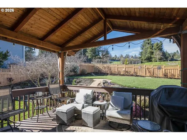 a view of yard from deck having patio