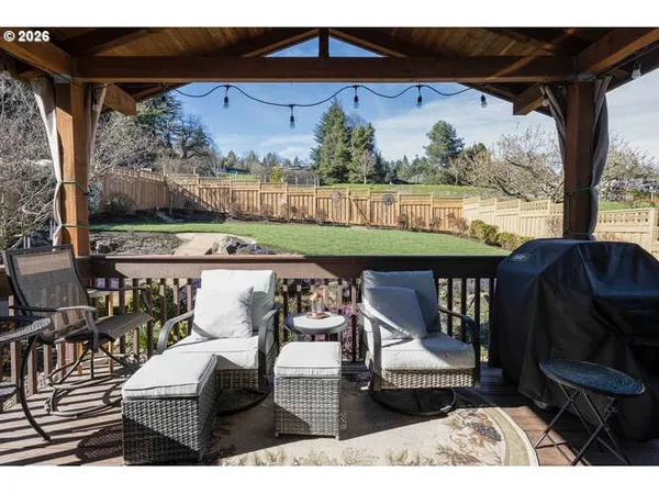 a view of a chairs and table in patio
