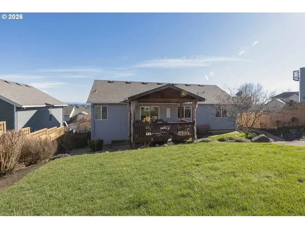 a view of a house with a yard and garage