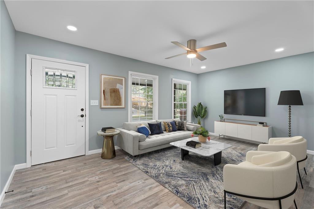 1939 Wee Kirk Road Southeast Atlanta, GA 30316 - Photo 12 of 43 a living room with furniture and a flat screen tv