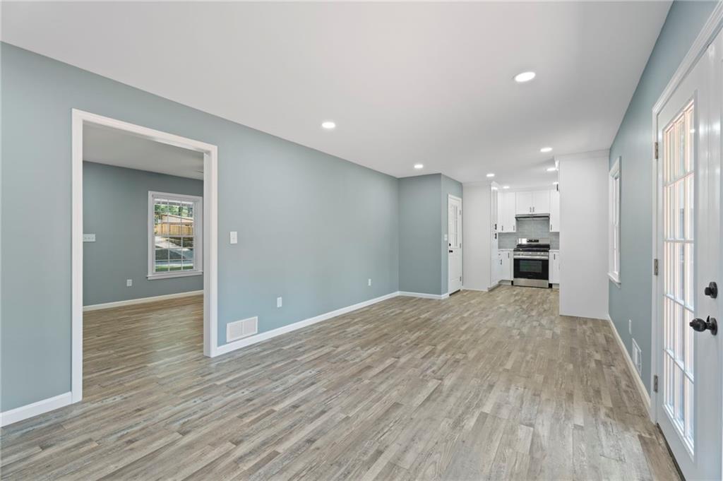 1939 Wee Kirk Road Southeast Atlanta, GA 30316 - Photo 15 of 43 a view of a kitchen with wooden floor and a window