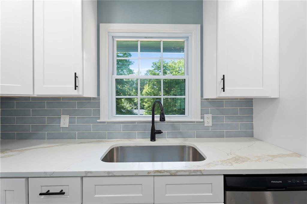1939 Wee Kirk Road Southeast Atlanta, GA 30316 - Photo 17 of 43 a kitchen with a sink and cabinets