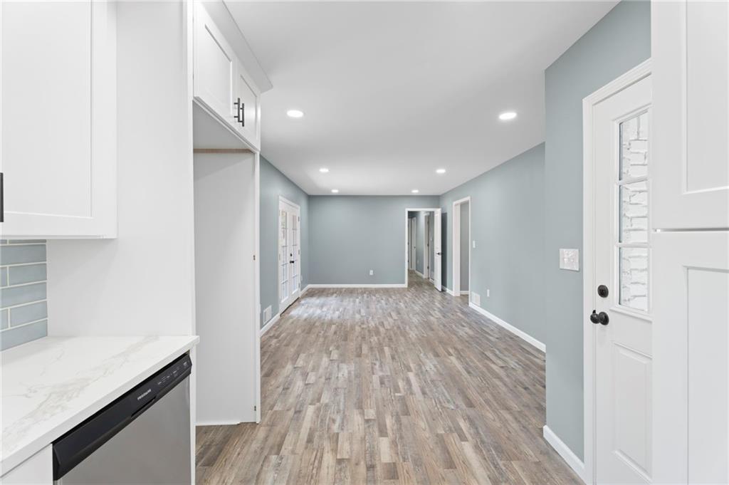 1939 Wee Kirk Road Southeast Atlanta, GA 30316 - Photo 19 of 43 a view of hallway with wooden floor