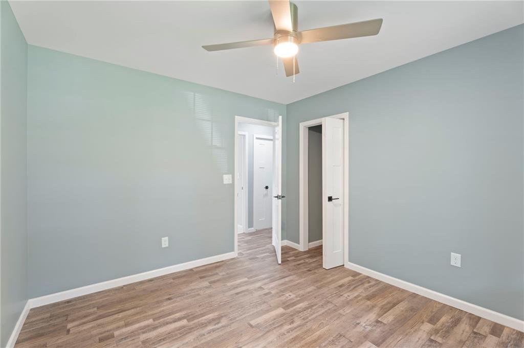 1939 Wee Kirk Road Southeast Atlanta, GA 30316 - Photo 25 of 43 an empty room with closet and a ceiling fan