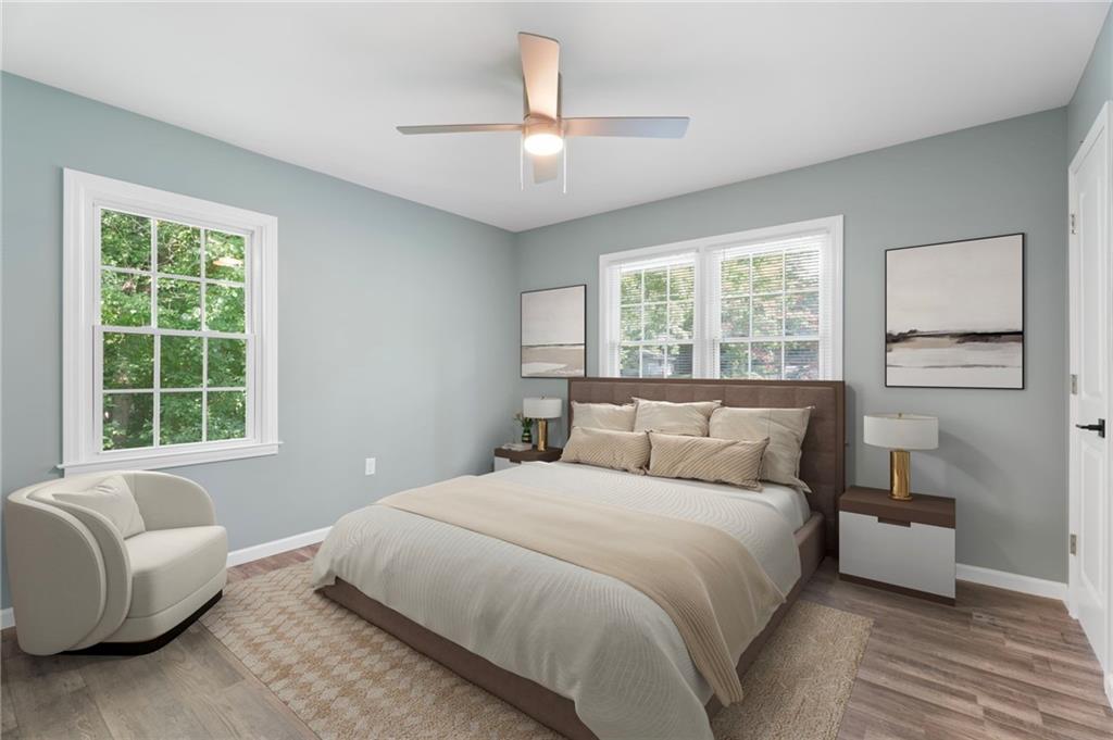 1939 Wee Kirk Road Southeast Atlanta, GA 30316 - Photo 27 of 43 a bedroom with a bed couch and window