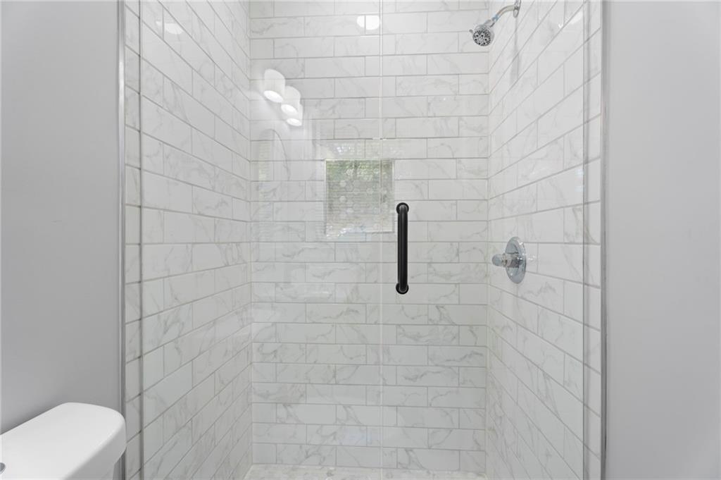 1939 Wee Kirk Road Southeast Atlanta, GA 30316 - Photo 30 of 43 a bathroom with a shower