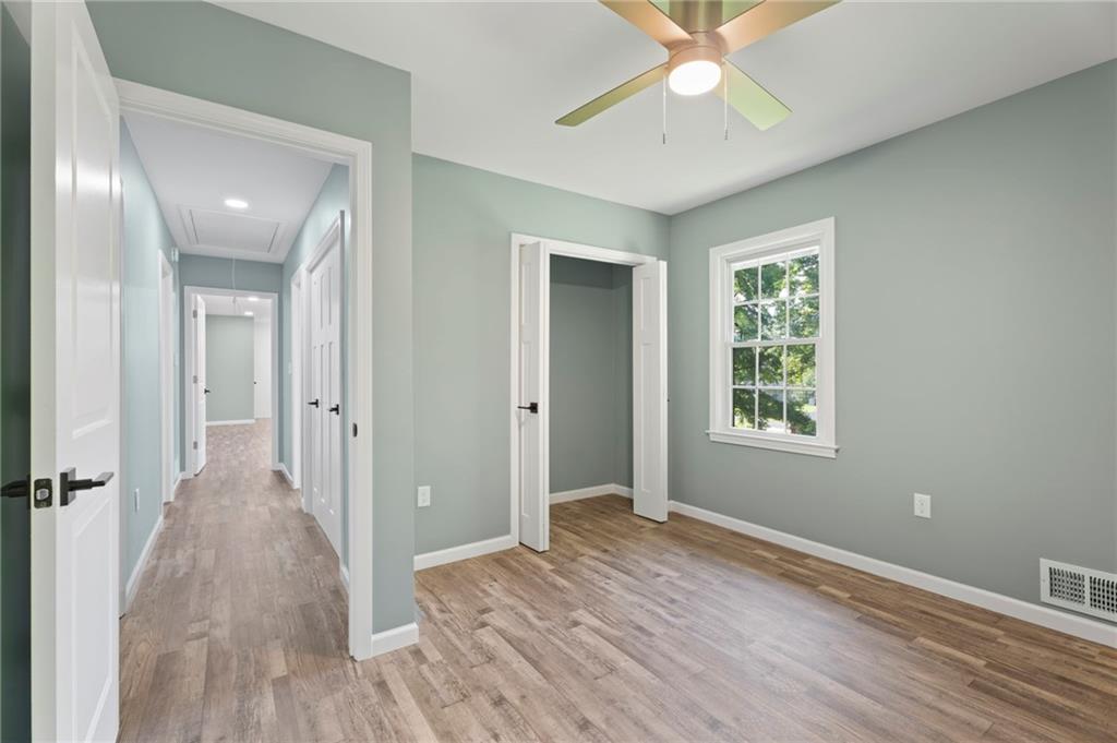 1939 Wee Kirk Road Southeast Atlanta, GA 30316 - Photo 32 of 43 wooden floor in an empty room with a window