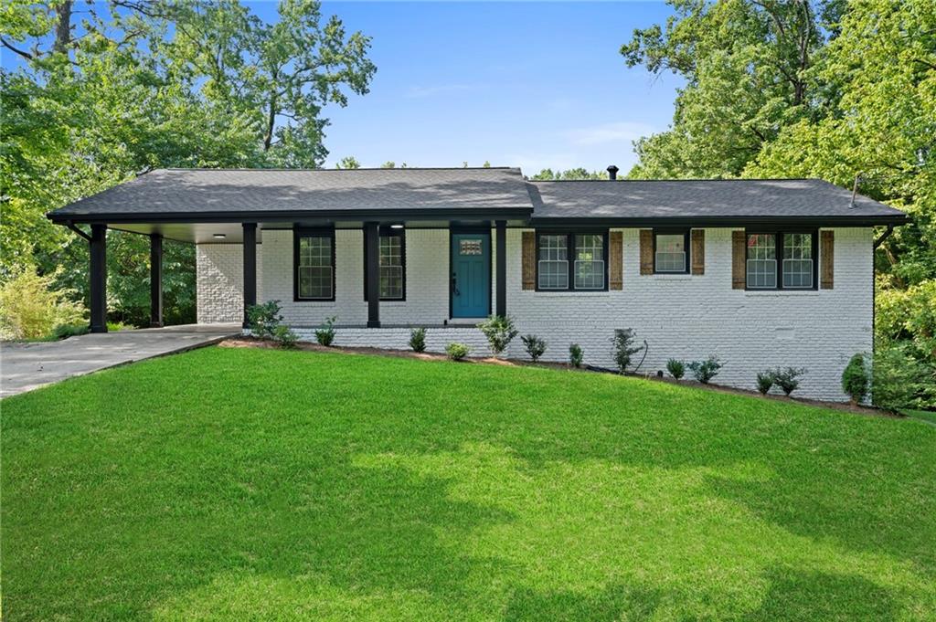 1939 Wee Kirk Road Southeast Atlanta, GA 30316 - Photo 4 of 43 a front view of a house with garden