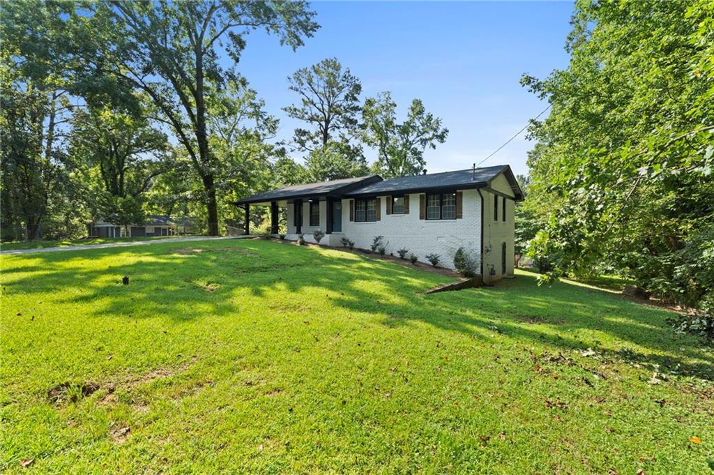 1939 Wee Kirk Road Southeast Atlanta, GA 30316 - Photo 6 of 43 a front view of house with yard and green space