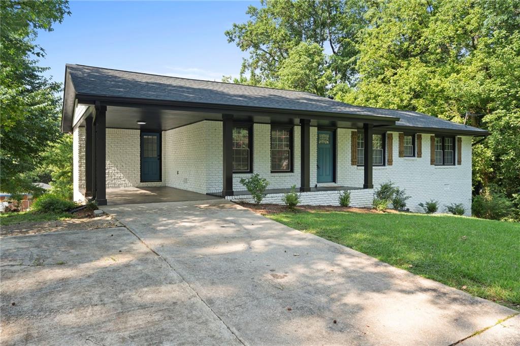 1939 Wee Kirk Road Southeast Atlanta, GA 30316 - Photo 8 of 43 a front view of a house with garden