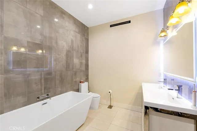 a bathroom with a bathtub and a sink