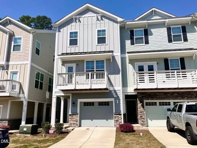 a front view of a building with many windows