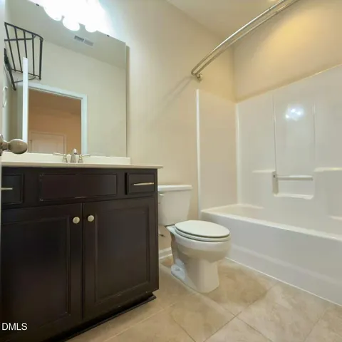 a kitchen with stainless steel appliances kitchen island granite countertop a stove top oven a sink and a granite counter top