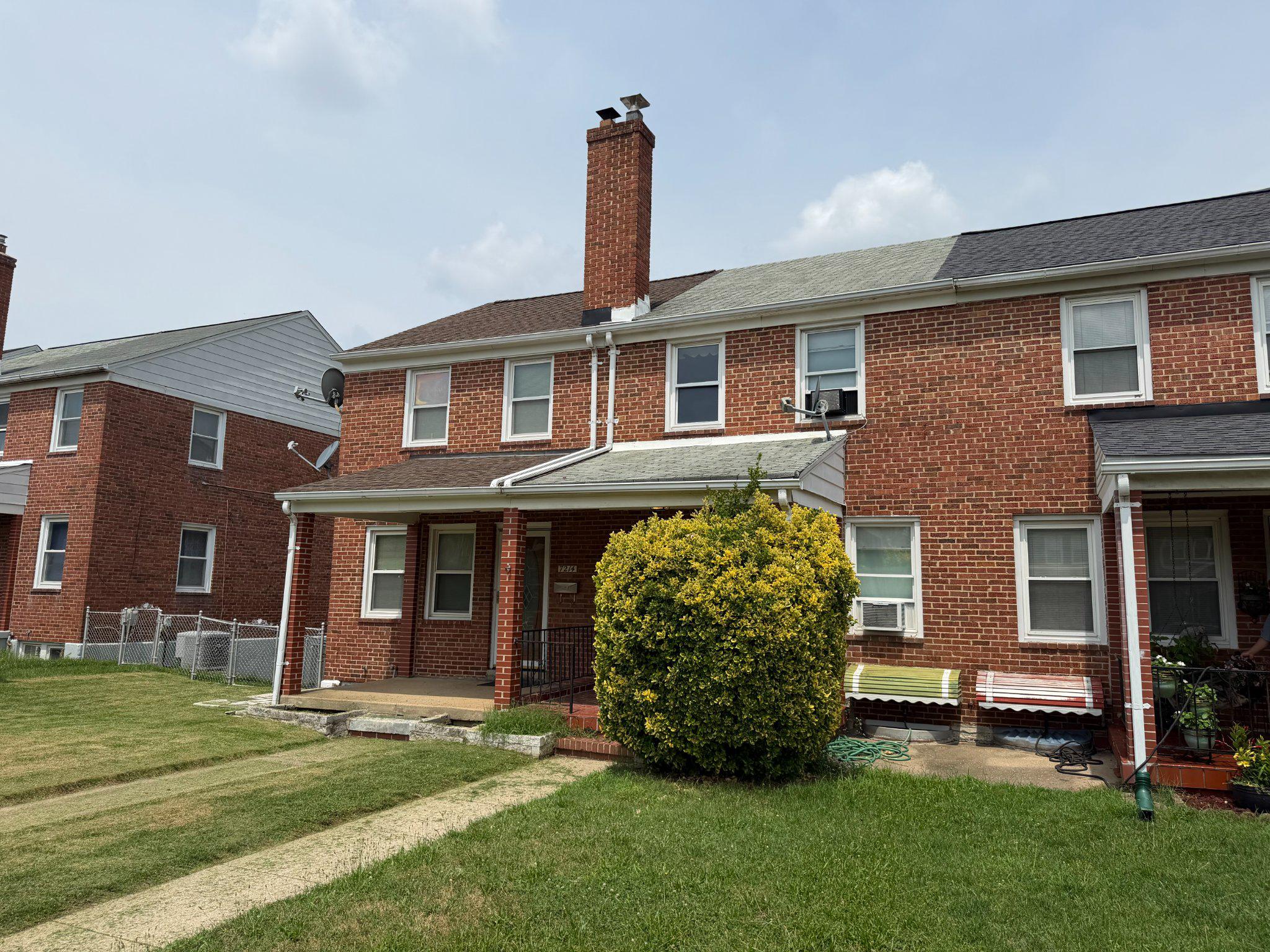 7216 Conley Street Baltimore, MD 21224 - Photo 2 of 14 Charming brick rowhome with lush greenery.