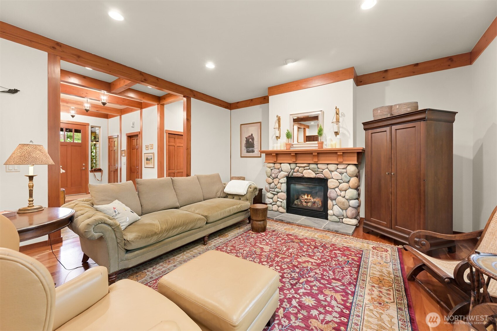 1910 40th Street Bellingham, WA 98229 - Photo 12 of 40 a living room with furniture a fireplace and a large window