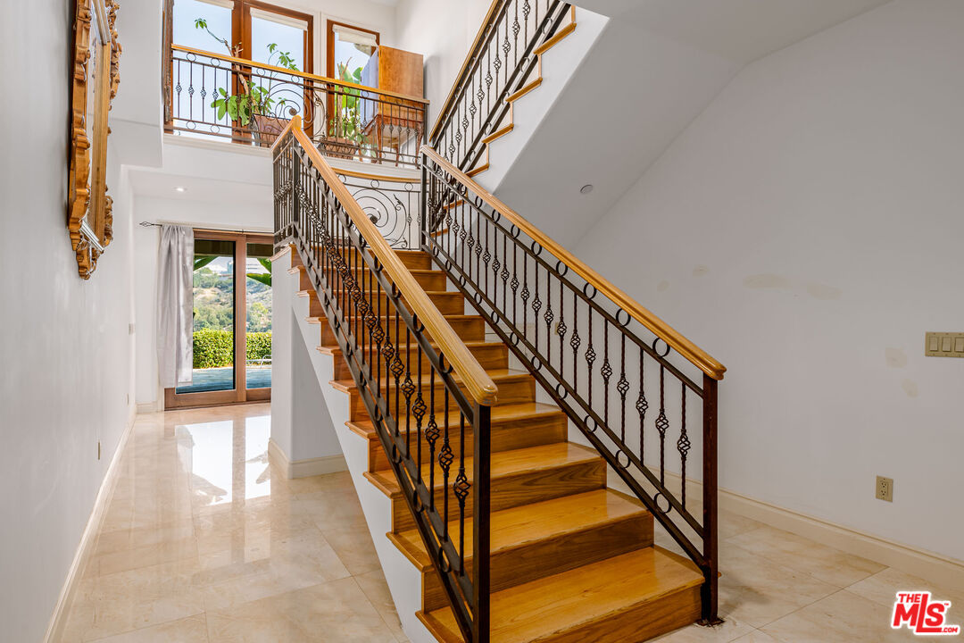 936 Kenfield Avenue Los Angeles, CA 90049 - Photo 14 of 30 a view of an entryway with wooden floor
