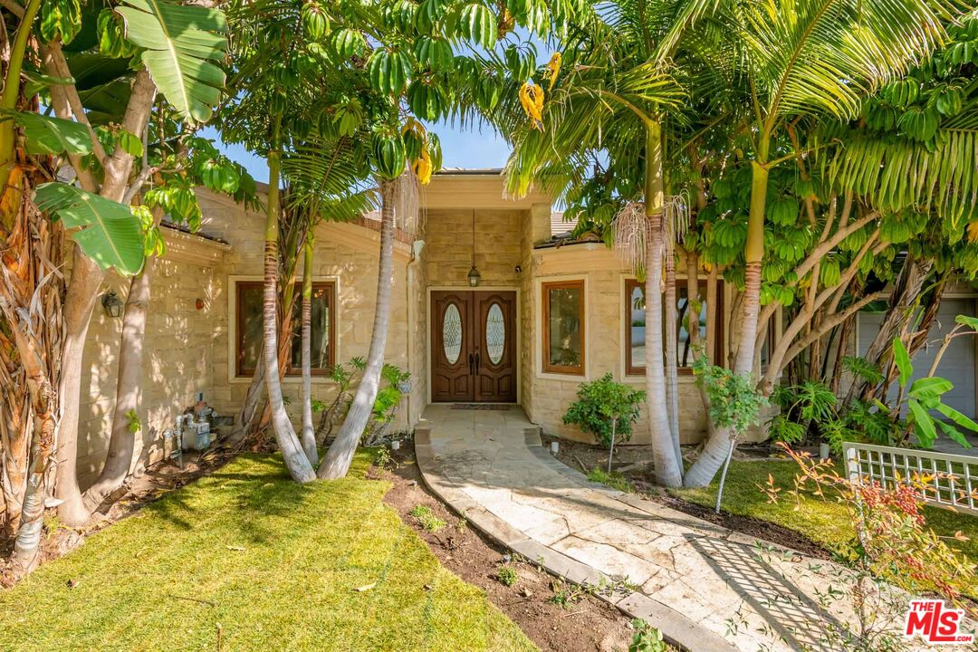 936 Kenfield Avenue Los Angeles, CA 90049 - Photo 2 of 30 a view of house with yard and seating area