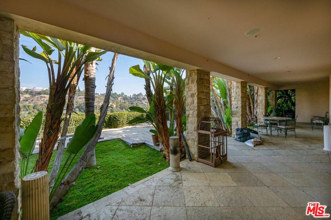 936 Kenfield Avenue Los Angeles, CA 90049 - Photo 27 of 30 a view of swimming pool with a patio
