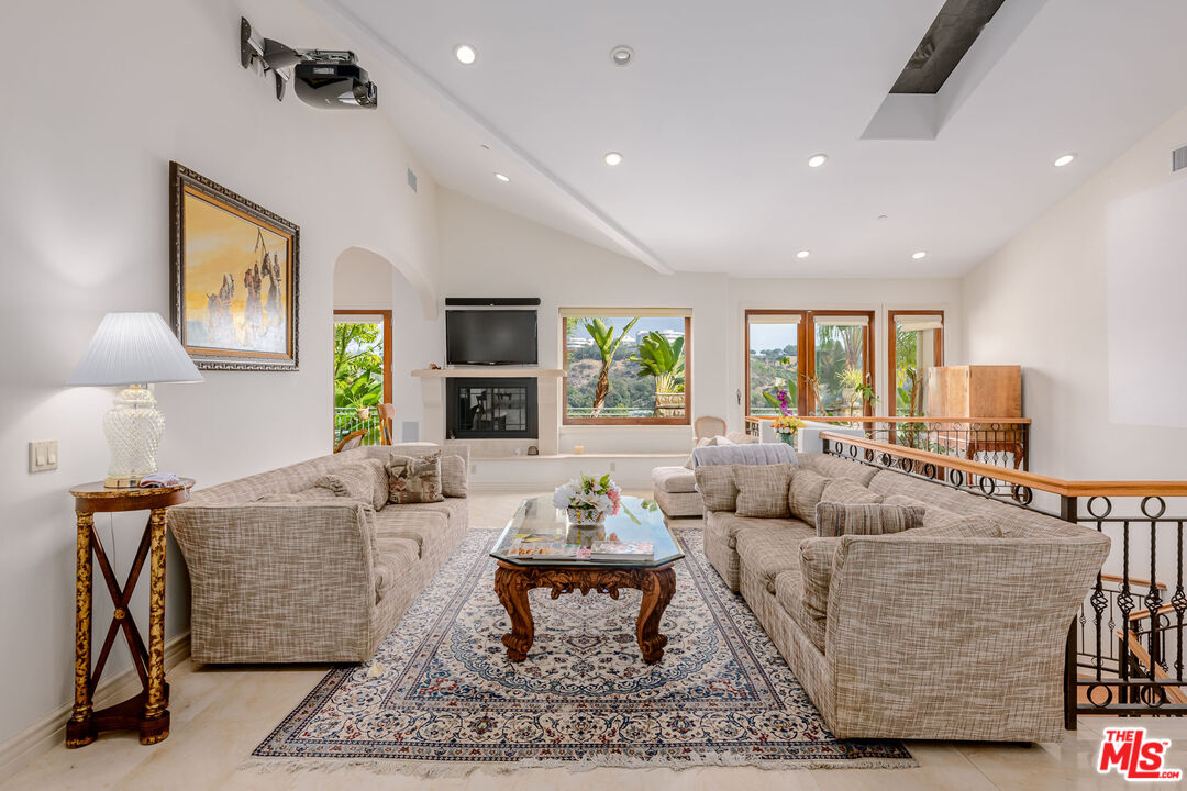 936 Kenfield Avenue Los Angeles, CA 90049 - Photo 4 of 30 a living room with furniture and a rug
