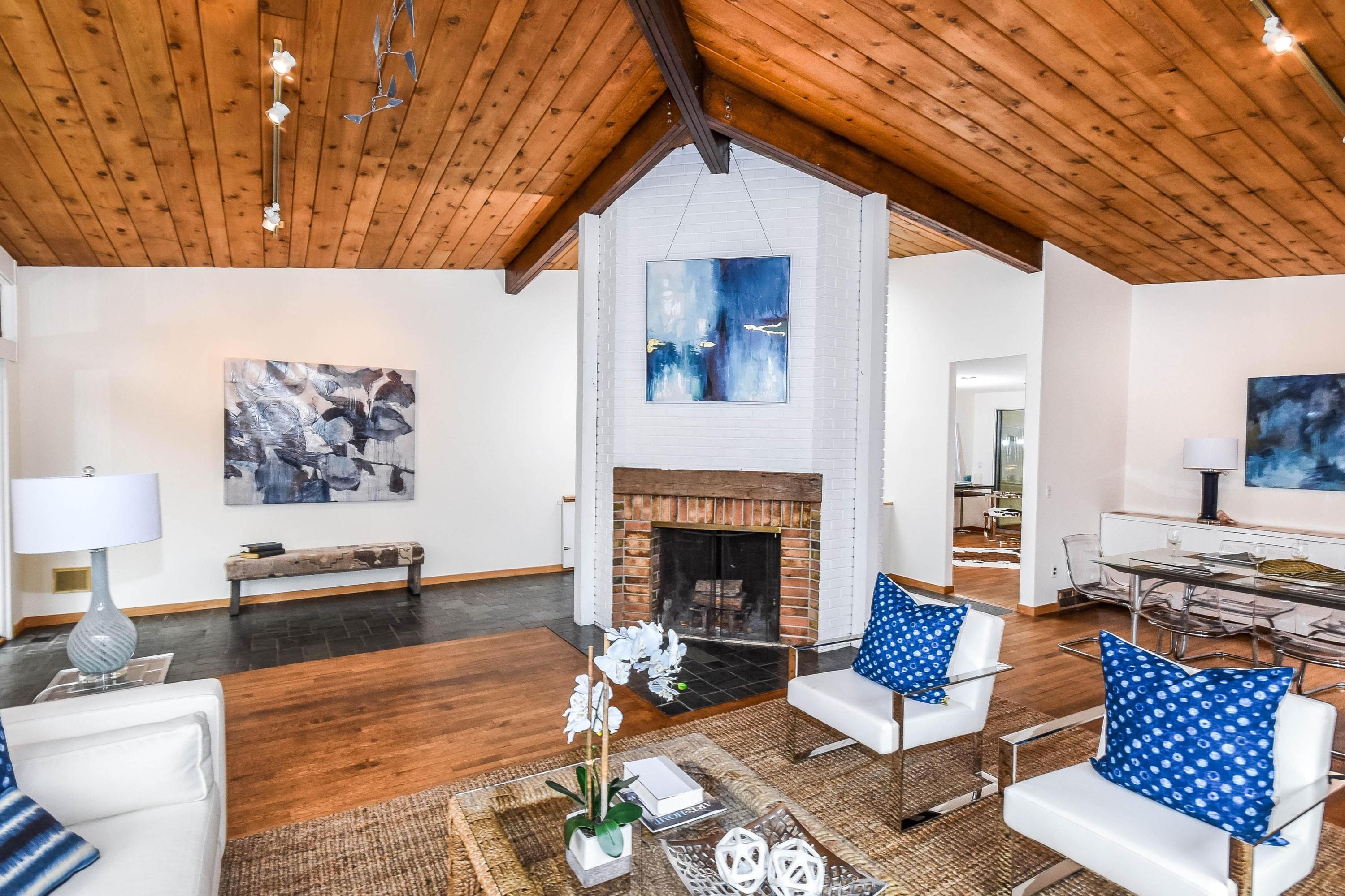 209 Frogtown Road New Canaan, CT 06840 - Photo 3 of 18 a living room with furniture and a fireplace