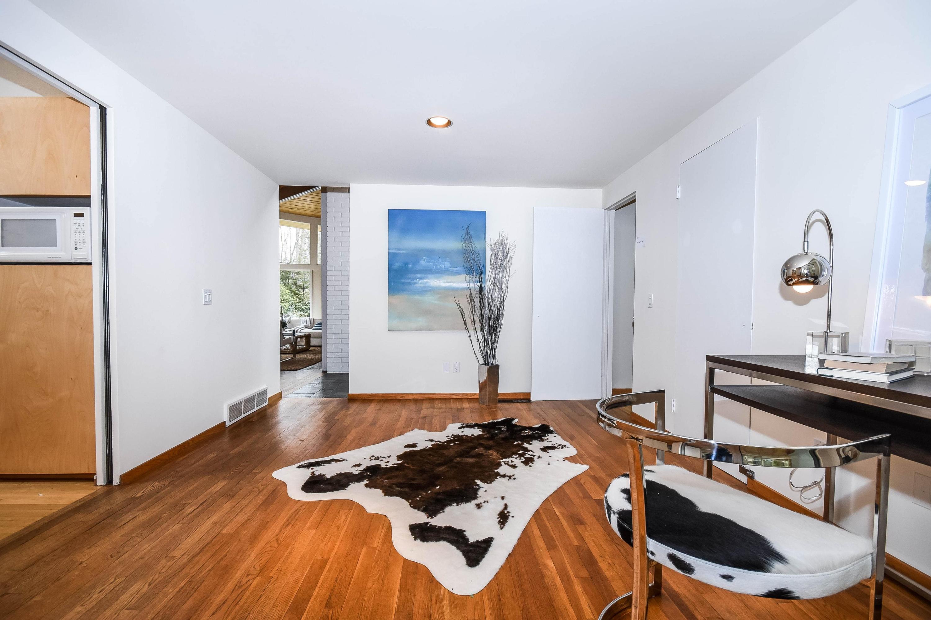 209 Frogtown Road New Canaan, CT 06840 - Photo 8 of 18 a bedroom with a bed and a table