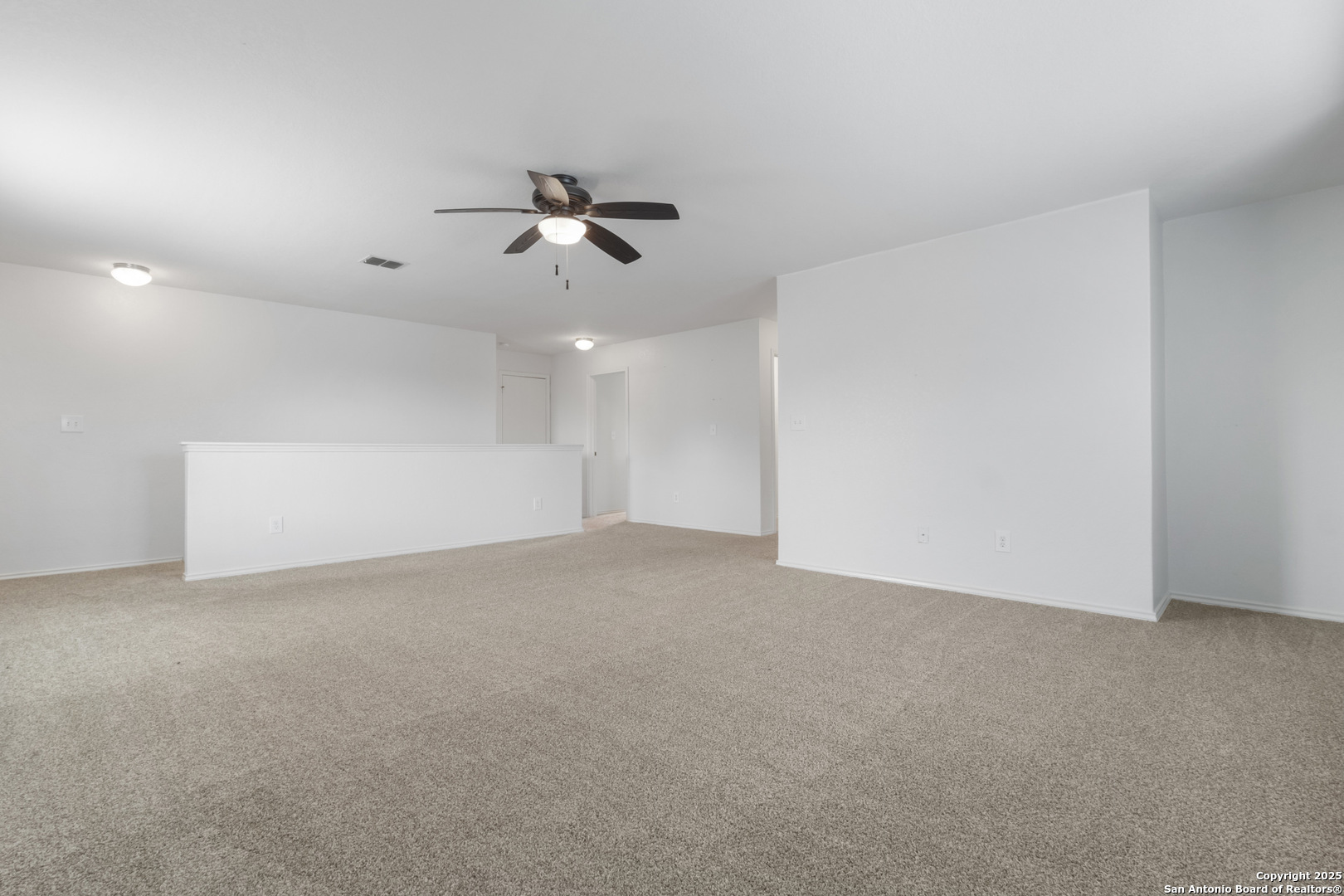 9418 Madison Creek Converse, TX 78109 - Photo 12 of 31 a view of a big room with carpet