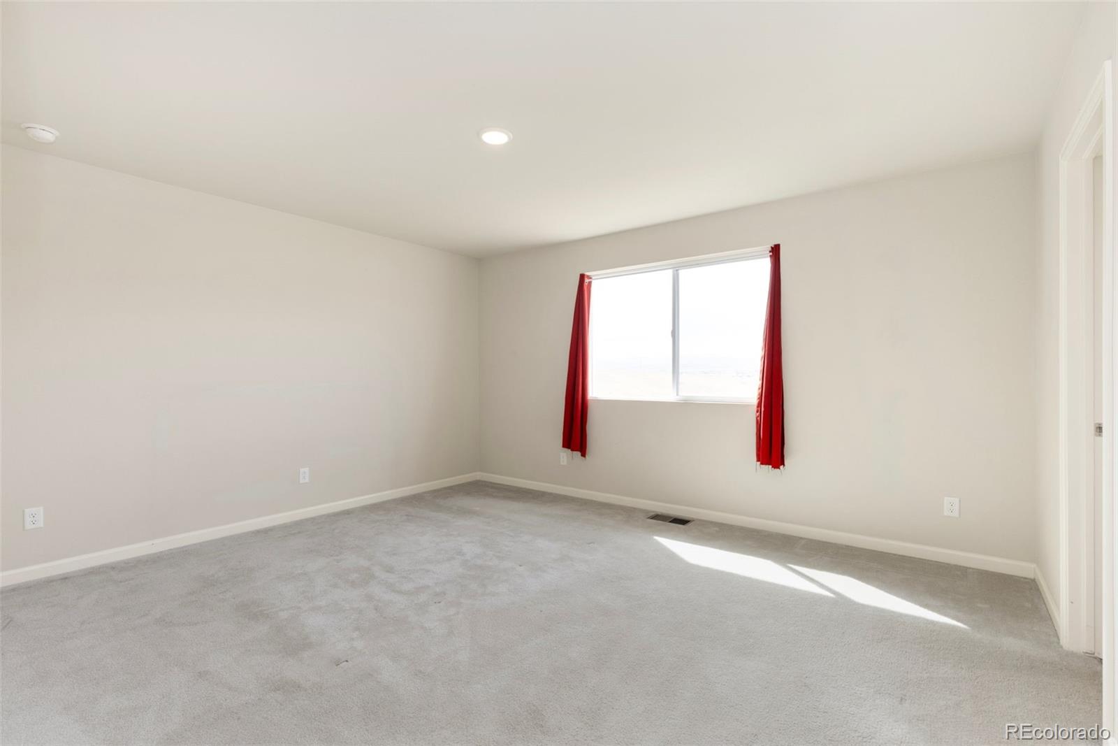 2771 Big Empty Place Berthoud, CO 80513 - Photo 13 of 25 an empty room with a window