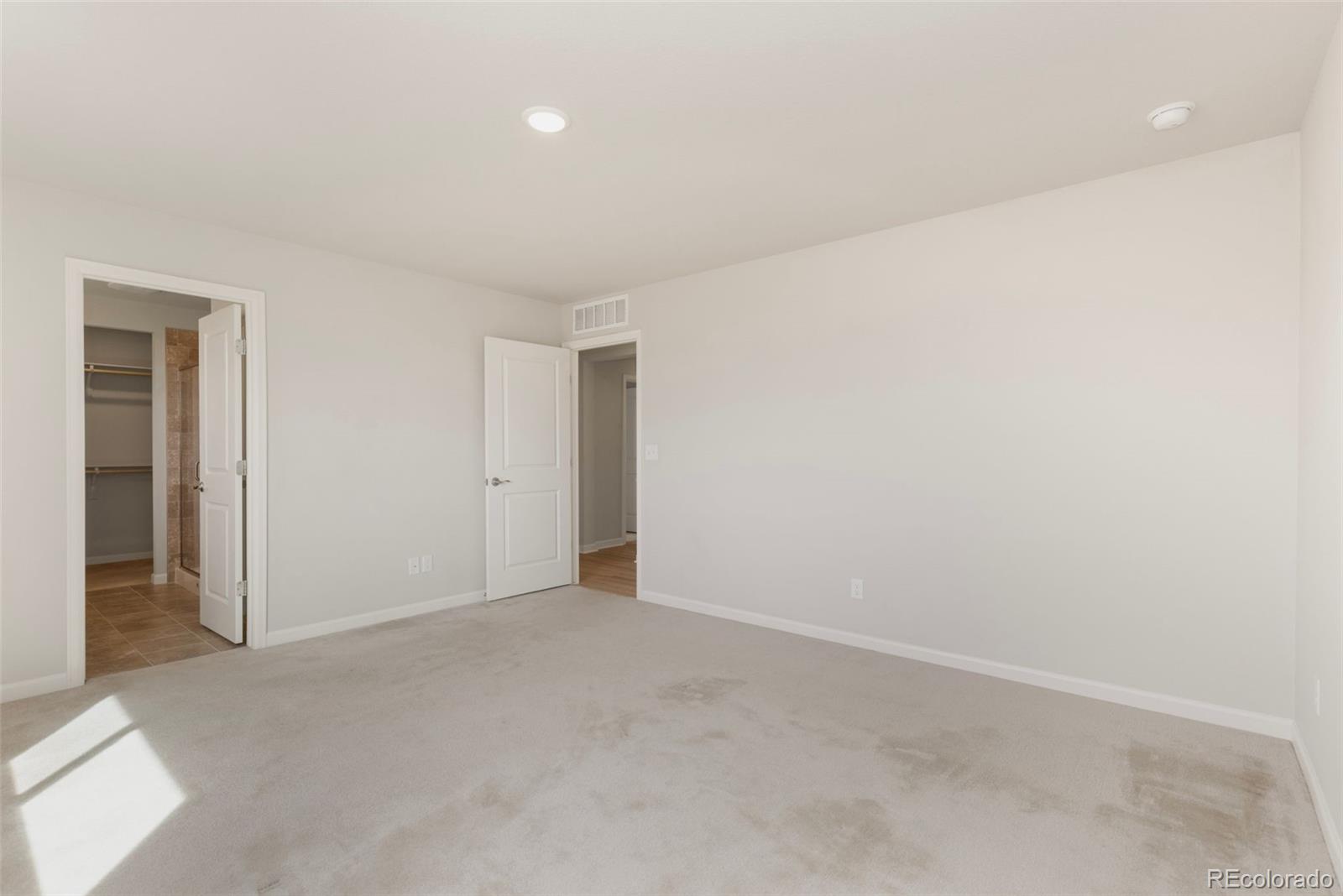 2771 Big Empty Place Berthoud, CO 80513 - Photo 14 of 25 an empty room with an entryway