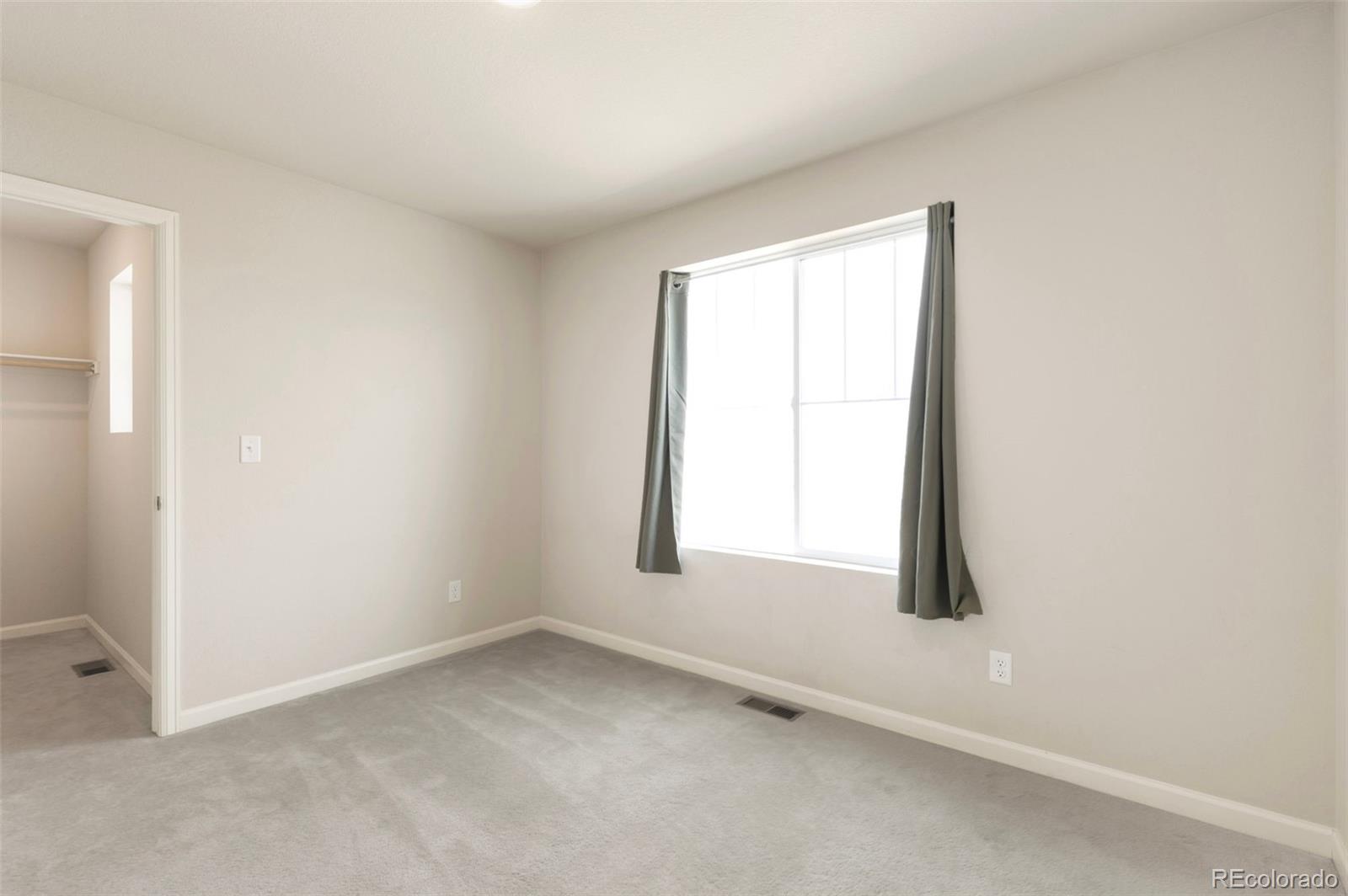 2771 Big Empty Place Berthoud, CO 80513 - Photo 21 of 25 an empty room with a window