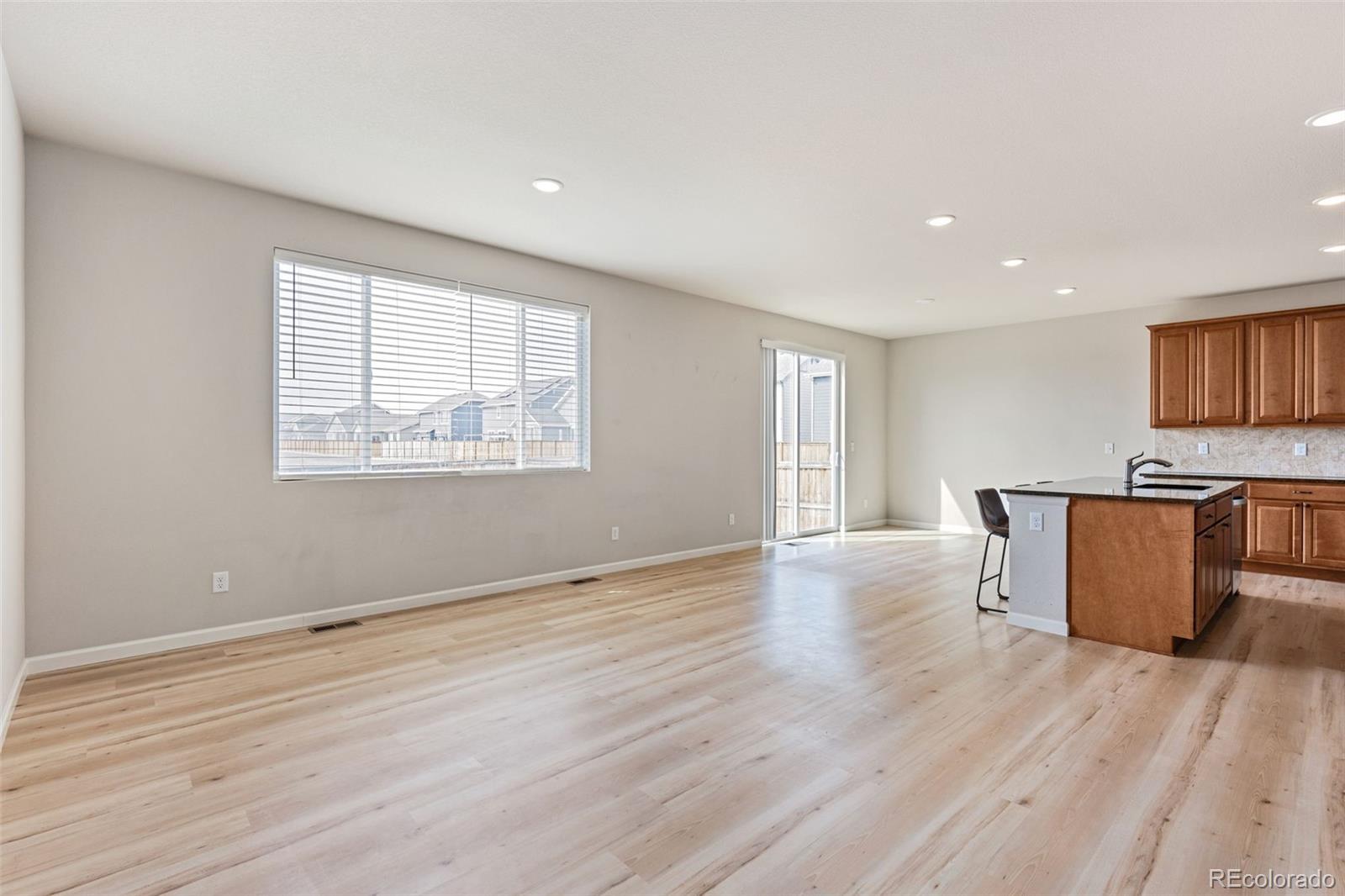 2771 Big Empty Place Berthoud, CO 80513 - Photo 5 of 25 a view of a kitchen with wooden floor and electronic appliances